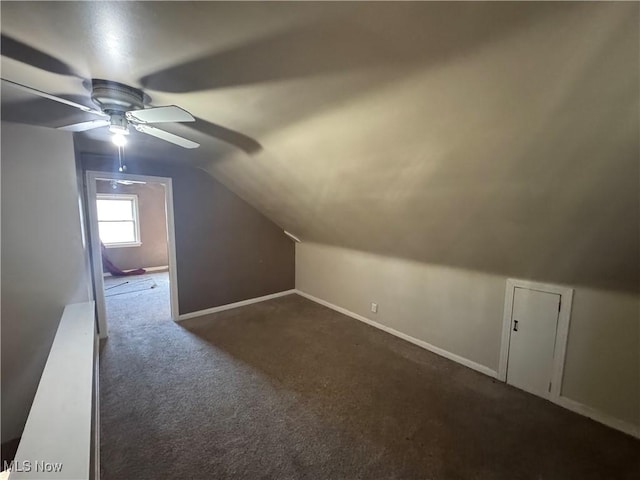 bonus room featuring carpet floors, baseboards, vaulted ceiling, and a ceiling fan