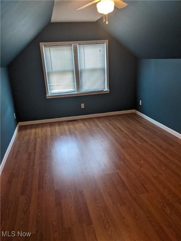 bonus room with ceiling fan, wood finished floors, lofted ceiling, and baseboards