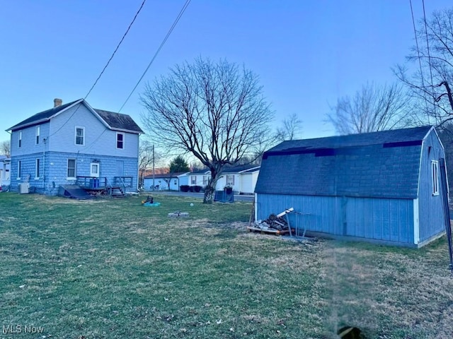 view of yard with an outdoor structure and a barn