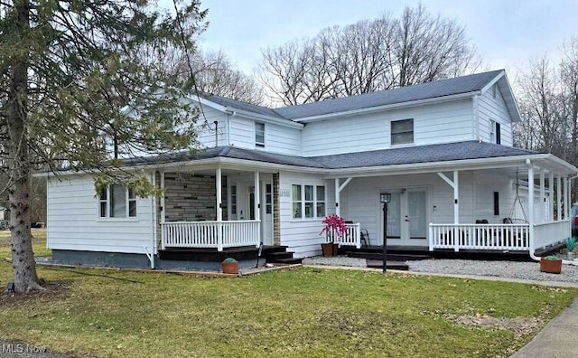 country-style home with french doors, a porch, and a front lawn