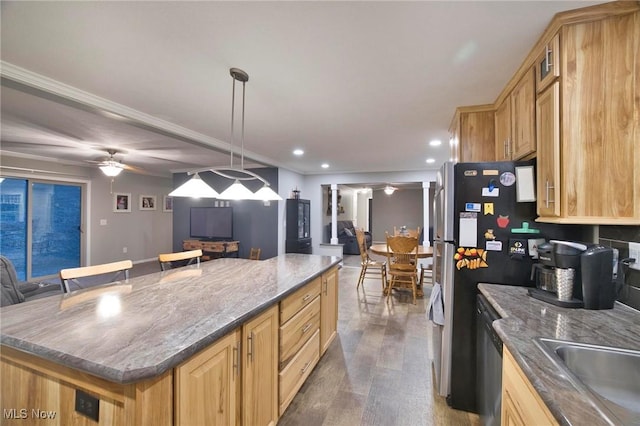 kitchen featuring decorative columns, recessed lighting, open floor plan, a kitchen island, and ceiling fan