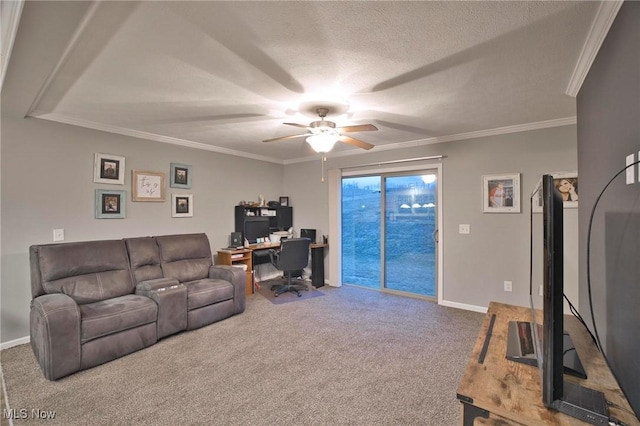 carpeted living room featuring ceiling fan, ornamental molding, a textured ceiling, and baseboards