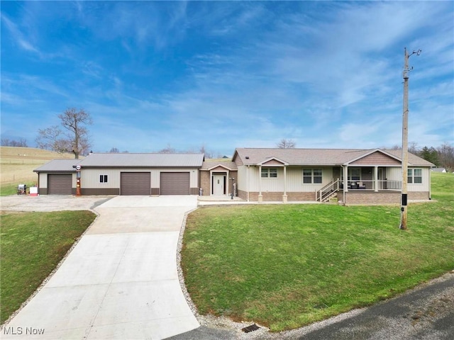 ranch-style house with driveway, a sunroom, an attached garage, a front yard, and brick siding