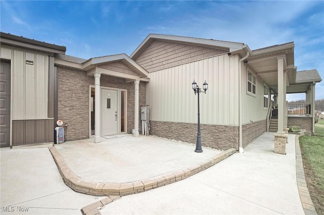 entrance to property with stone siding