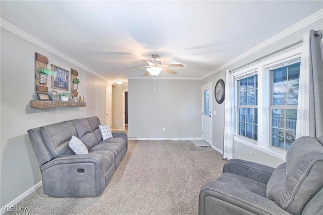 carpeted living area featuring crown molding, ceiling fan, and baseboards