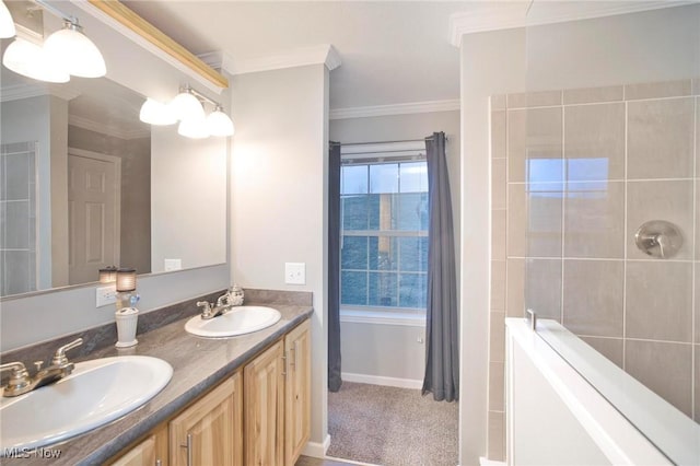 full bath with crown molding, a sink, and a tile shower