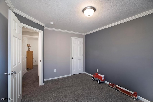 unfurnished bedroom with crown molding, a textured ceiling, carpet flooring, and baseboards