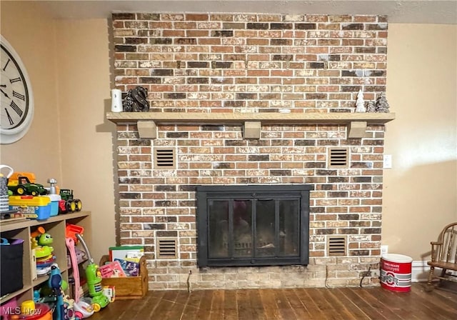 room details with a fireplace and wood finished floors