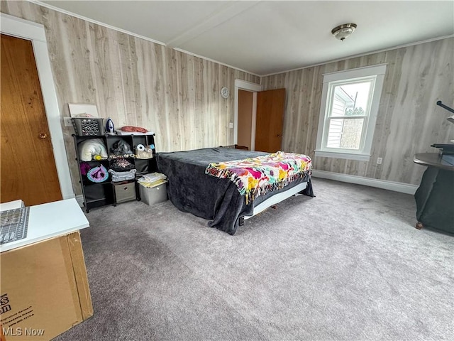 carpeted bedroom with baseboards and ornamental molding