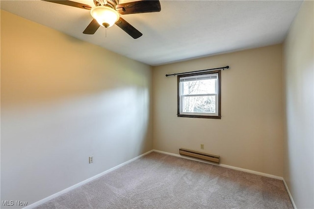 empty room featuring a baseboard radiator, baseboards, ceiling fan, and carpet