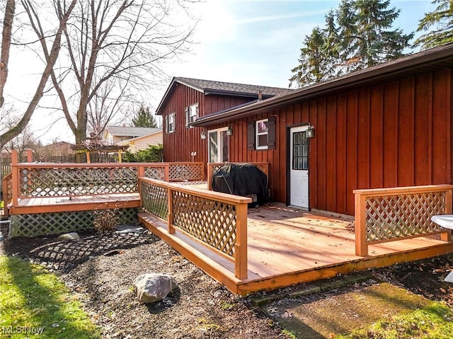 wooden terrace with a grill