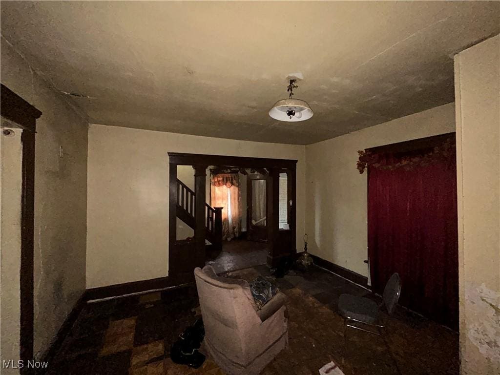 interior space featuring stairs and baseboards