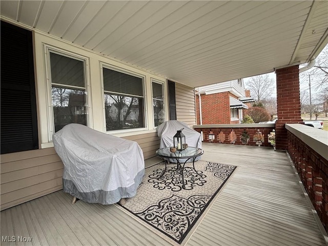 wooden terrace featuring a porch