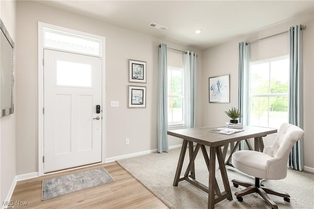 entryway with light wood-style floors, recessed lighting, visible vents, and baseboards