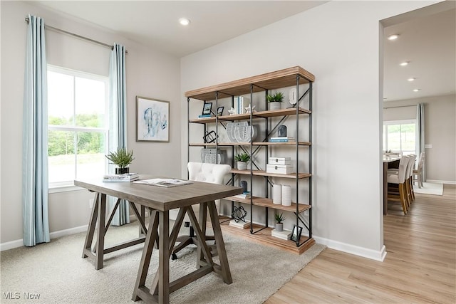 office space with recessed lighting, light wood-style flooring, and baseboards