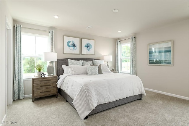 bedroom with recessed lighting, baseboards, and light colored carpet