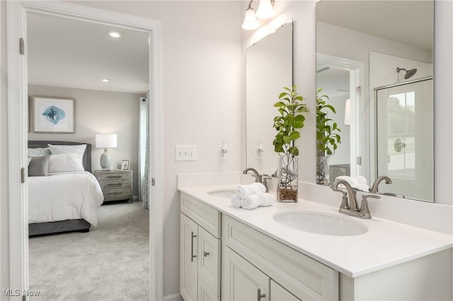 full bath with double vanity, an enclosed shower, ensuite bath, and a sink