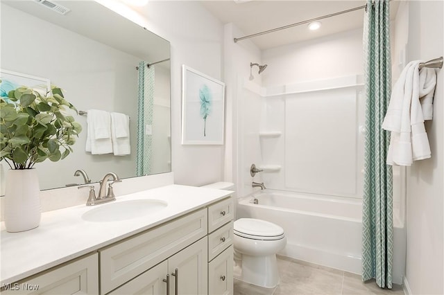 bathroom featuring toilet, shower / tub combo, vanity, visible vents, and tile patterned floors