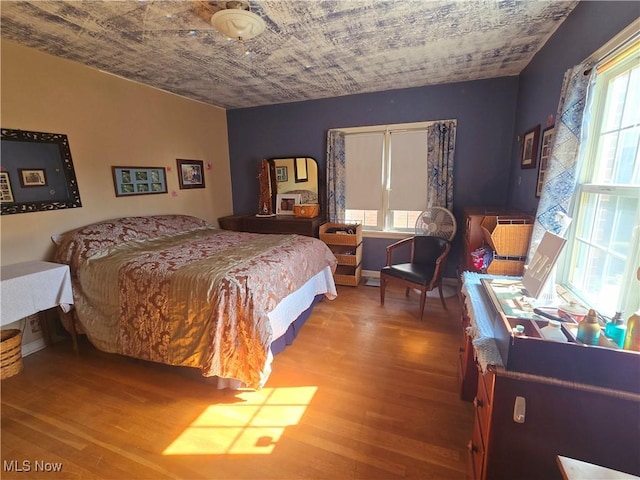 bedroom with wood finished floors