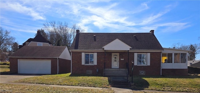 view of front of house with an outdoor structure, a front lawn, concrete driveway, and brick siding