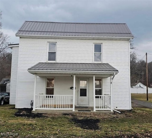 view of front of home featuring a porch and metal roof