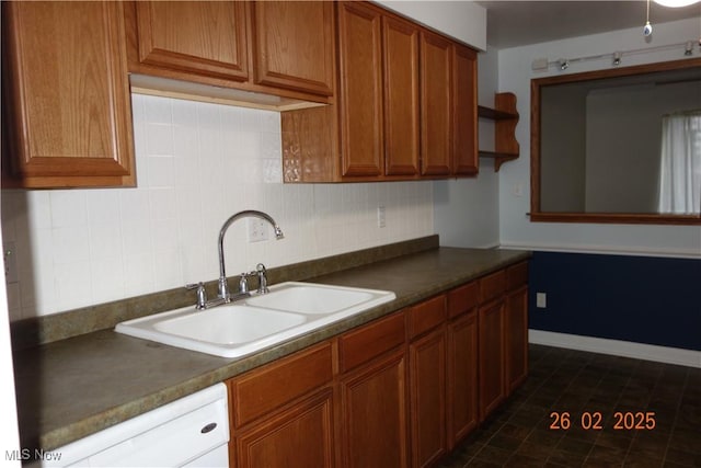 255 N Portage Path Unit 208, Akron, OH 44303 - kitchen with a sink, decorative backsplash, dark countertops, and brown cabinets