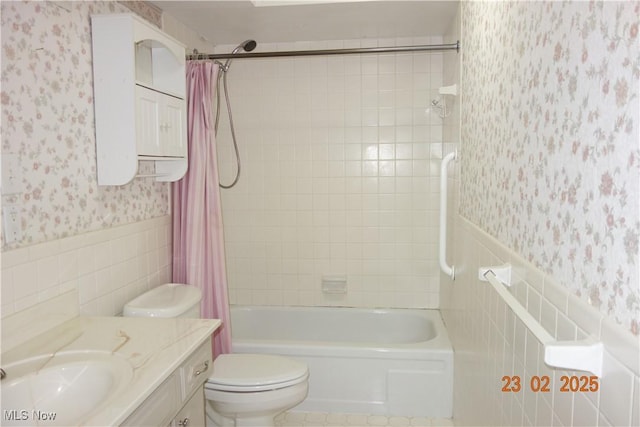 255 N Portage Path Unit 208, Akron, OH 44303 - full bathroom with wallpapered walls, tile walls, shower / bath combination with curtain, toilet, and wainscoting