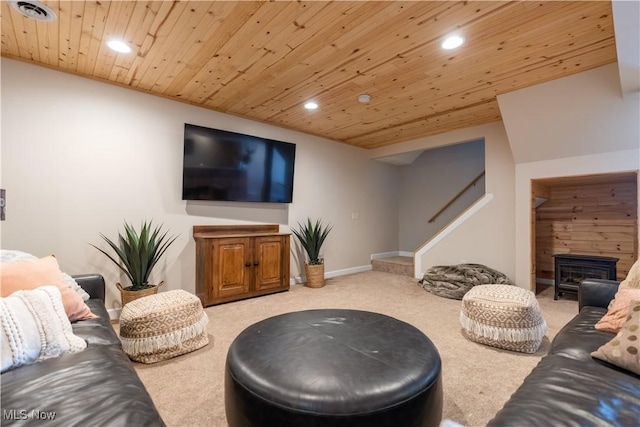 carpeted living room with stairs, wooden ceiling, a fireplace, and recessed lighting