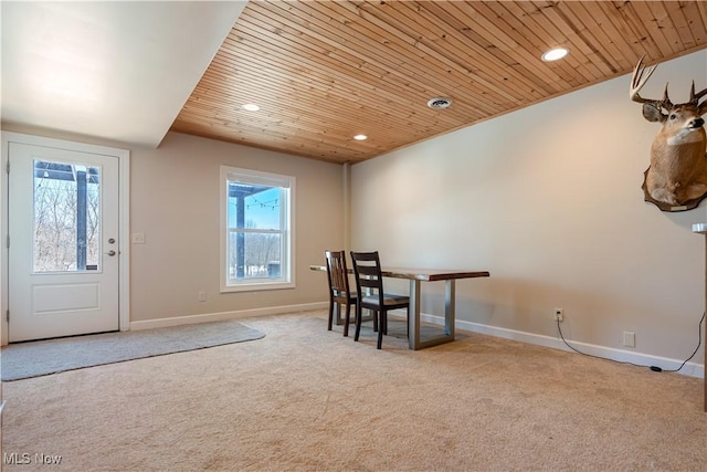 interior space with carpet floors, recessed lighting, wood ceiling, and a healthy amount of sunlight