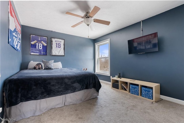 bedroom featuring carpet, baseboards, and ceiling fan