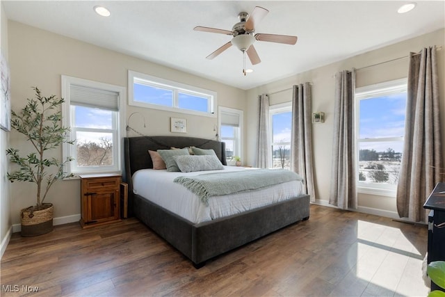 bedroom with a ceiling fan, baseboards, wood finished floors, and recessed lighting