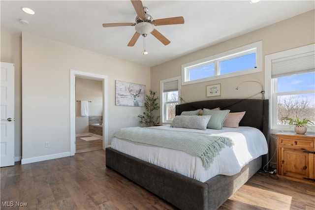 bedroom featuring ceiling fan, connected bathroom, baseboards, and wood finished floors