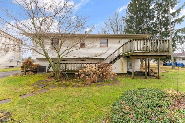 back of house with a yard, stairway, a wooden deck, and central air condition unit