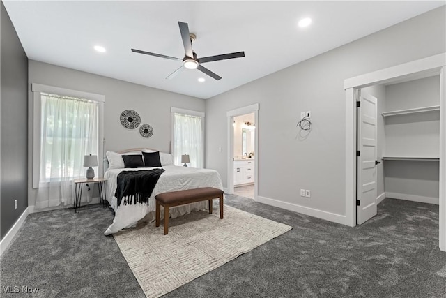 bedroom with baseboards, ceiling fan, ensuite bath, dark colored carpet, and recessed lighting