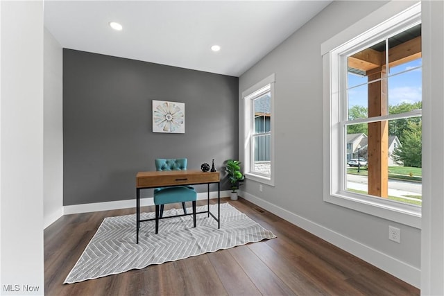 office space featuring baseboards, wood finished floors, and recessed lighting