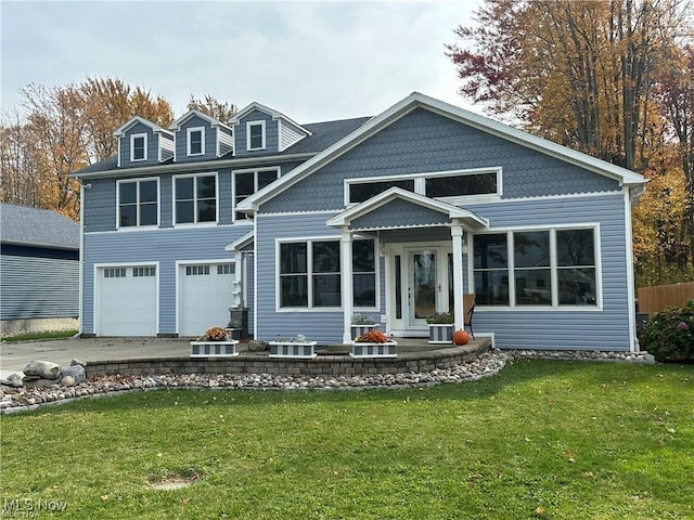 view of front facade featuring a garage and a front yard