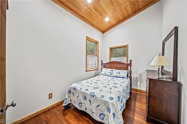 bedroom with lofted ceiling, wooden ceiling, baseboards, and wood finished floors