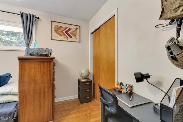 office featuring light wood-style floors and baseboards