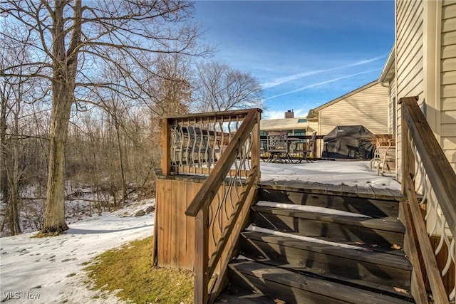 view of snow covered deck