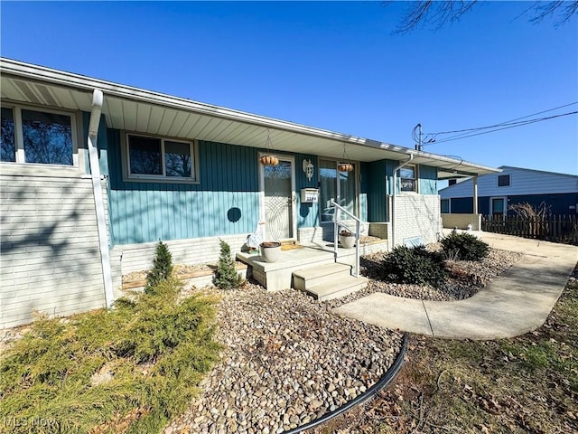 view of front of house with brick siding