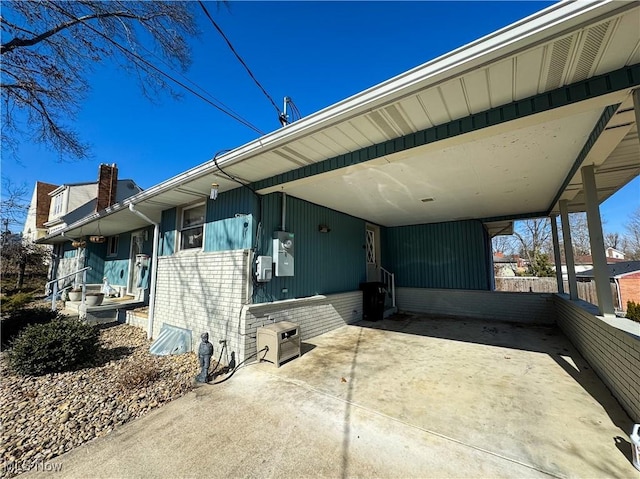 view of patio / terrace with an attached carport