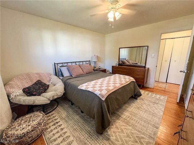 bedroom with ceiling fan and light wood finished floors