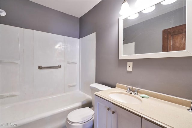 bathroom with toilet, shower / bath combination, and vanity