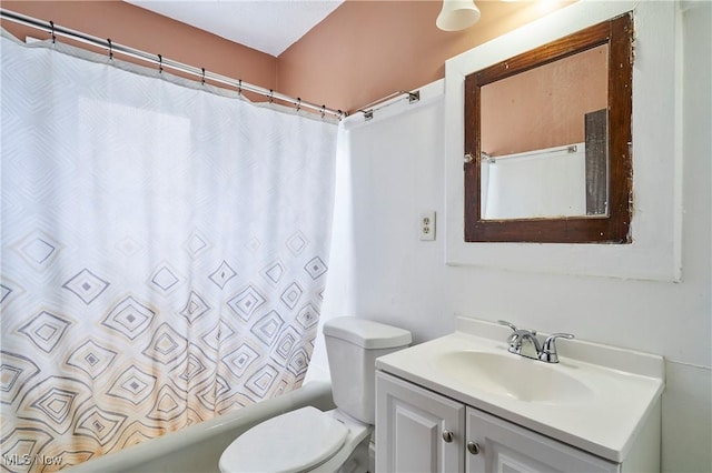 bathroom with toilet, shower / tub combo with curtain, and vanity