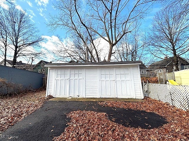 detached garage with fence