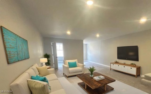 living area with carpet and baseboards