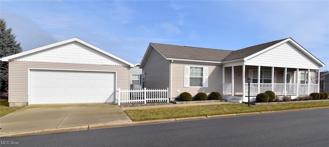 view of front of property featuring a garage, covered porch, and fence