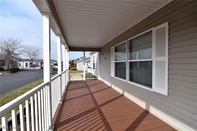5655 E Windjamer Ave, Lakeside-Marblehead, OH 43440 - balcony featuring a residential view and a porch