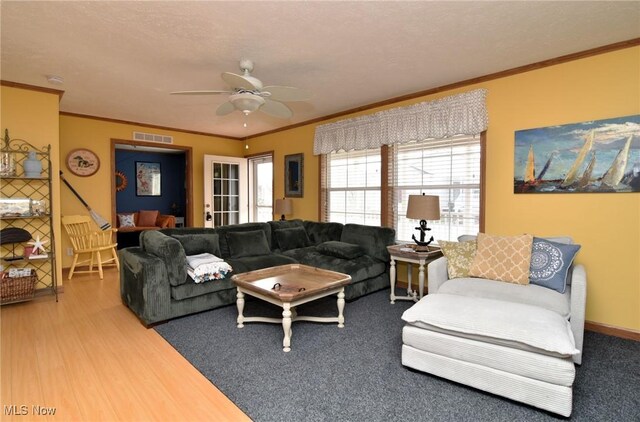 5655 E Windjamer Ave, Lakeside-Marblehead, OH 43440 - living room with a ceiling fan, visible vents, wood finished floors, and ornamental molding