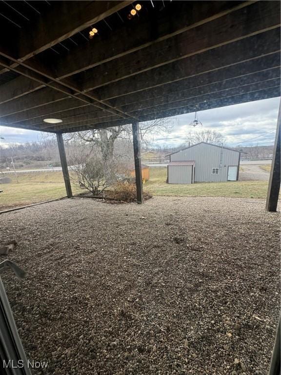 view of yard with a pole building and an outbuilding